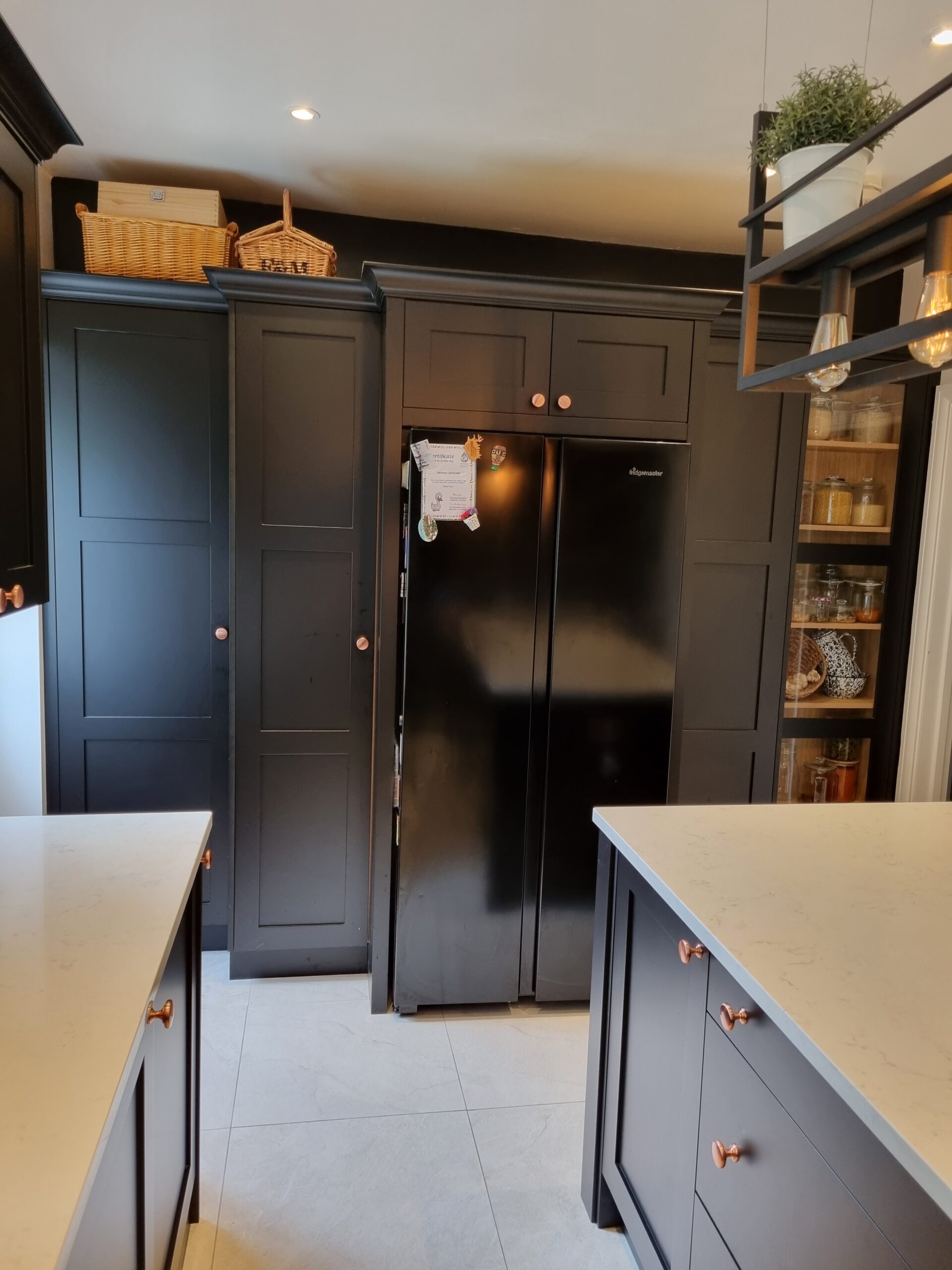 https://www.bespokekitchensandfurniture.com/wp-content/uploads/2022/07/Bespoke-Shaker-Style-Kitchen-Fridge-Freezer-Housing-Unit-Spray-Paint-Finished-In-Matt-Black-2-scaled.jpg